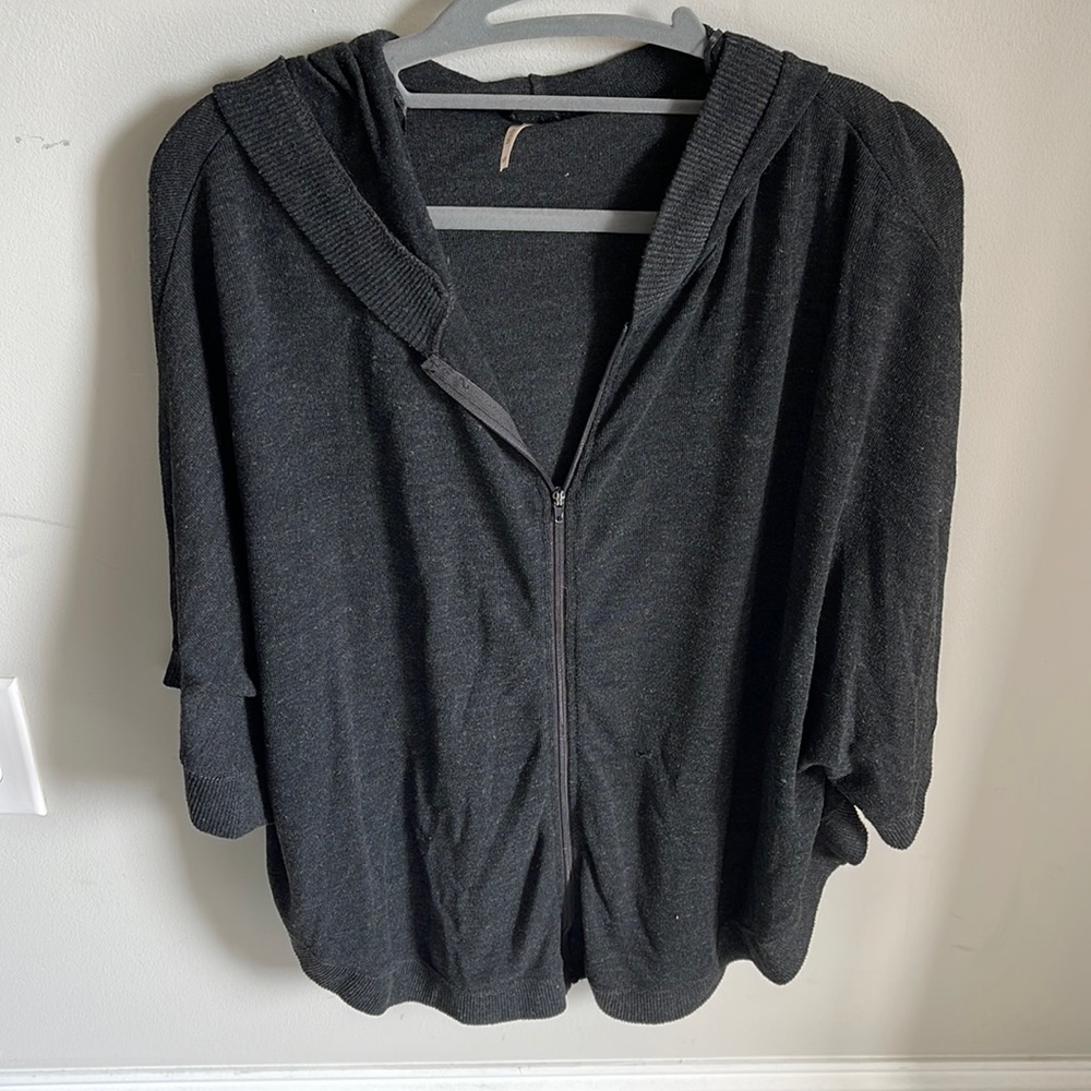 Steel grey zip-up poncho with hood.